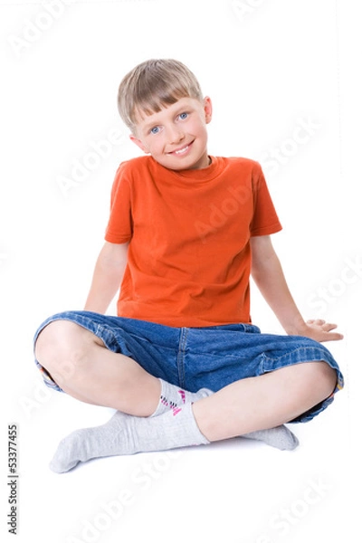 Obraz A boy sitting with legs crossed