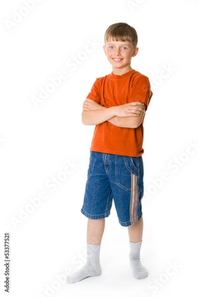 Obraz A smiling boy with his hands crossed