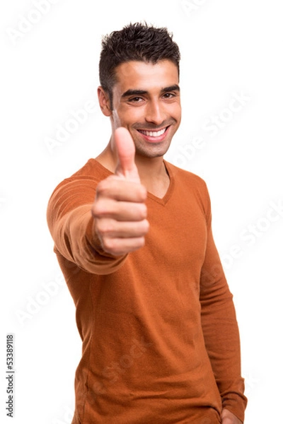 Fototapeta Smiling guy showing thumbs UP