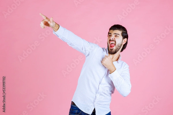 Obraz Person Taking a Selfie with a Smartphone Against a Pink Background
