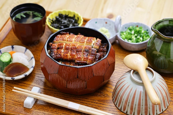 Obraz Hitsumabushi is a Japanese Nagoya rice dish decorated with grilled Unagi eel at the top. The eel is served in smaller pieces that allows it to be enjoyed with three ways.
