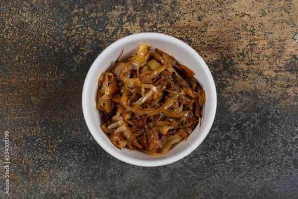 Obraz Caramelized onion pieces in white bowl