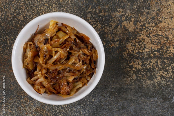 Obraz Caramelized onion pieces in white bowl