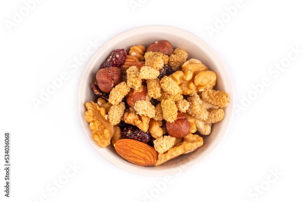 Obraz Mixed nuts and dried fruits on the white background