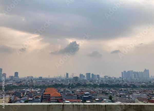 Obraz View of Jakarta city from the rooftop during cloudy day