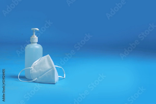 Fototapeta medical masks and antiseptic bottles for protection from pandemics germs and viruses

