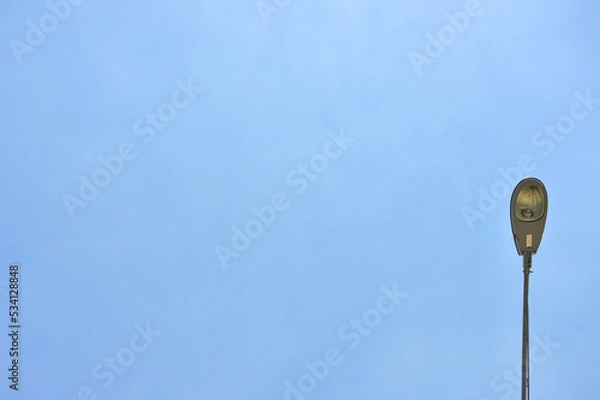 Fototapeta Street light lamp post led with panel system on the road with blue sky.