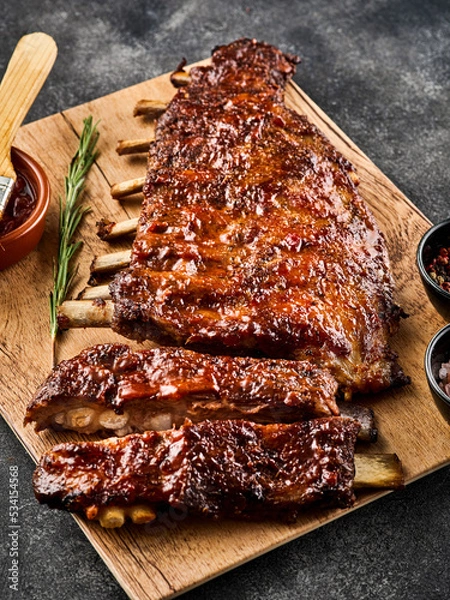 Obraz American style pork ribs. Delicious barbecued ribs seasoned with a spicy basting sauce