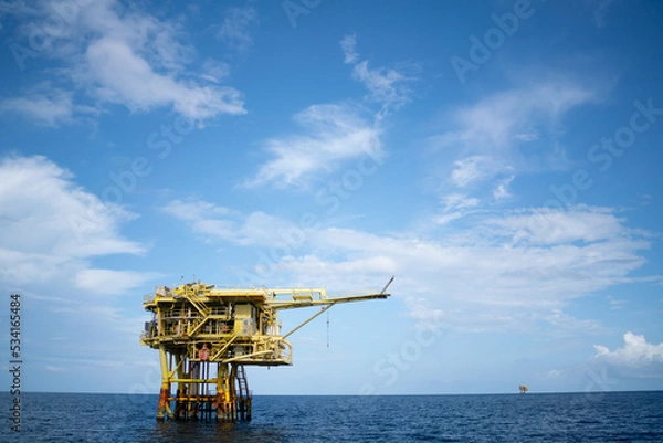 Fototapeta Offshore oil and gas wellhead remote platform which produced raw material for sent to onshore refinery, power generation and petrochemical industry.