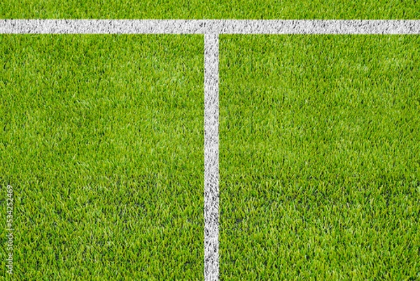 Obraz Top view of the white Line marking on the artificial green grass soccer field.