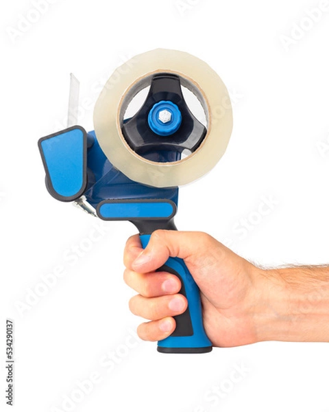 Fototapeta Tape dispenser in man hand isolated on a white background. Tape machine with tape roll.