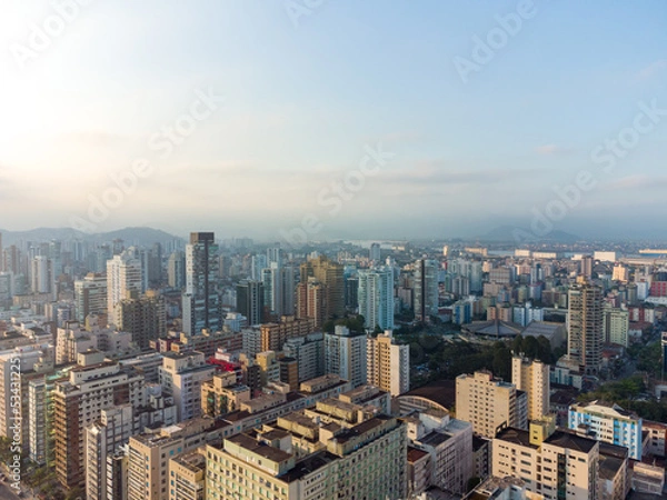 Fototapeta Aerial view of the waterfront to the ocean with its high buildings in the city of Santos in Brazil