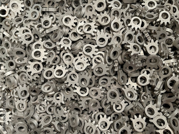 Obraz batch of metallic steel parts, mass production of toothed sprockets, lots of steel parts, fine blanking of gear wheels, manufacture of car parts, cold stamping of components