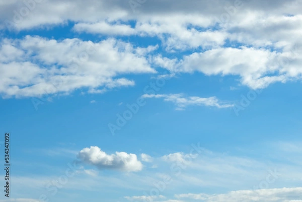 Fototapeta Blue sky with white clouds. Beautiful cloudy sky. Skyward. Endless skyline. The sky at dawn.