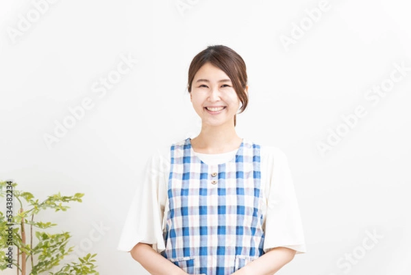 Obraz エプロンをした笑顔の保育士