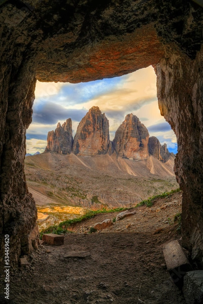 Obraz View to Tre Cime di Lavaredo in sunrise time from a cave, which was used during the First World War, Dolomites