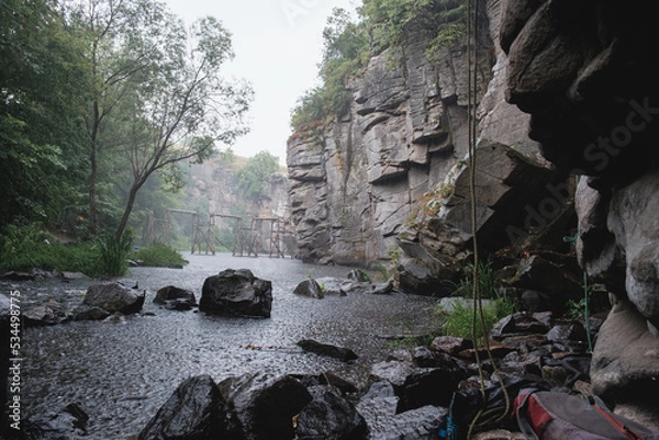Obraz Climbing area Buksky canyon, rain on the Gorsky Tikich river near high granite rocks, Cherkasy region