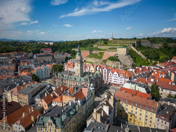 Fototapeta Kłodzko - a city situated in the mountains. Sunny day and clouds in the blue sky in the mountains.