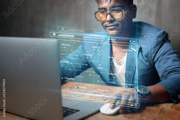 Fototapeta Analytical businessman working with computers in Business Analytics and Data Management System to create investment schedules, reports with KPIs and metrics connected to a database. financial strategy