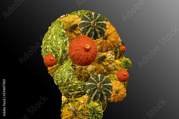 Fototapeta Head of a person made of decorative and halloween pumpkins. Halloween or vegetarian symbol.
