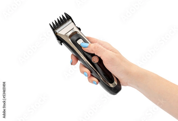 Fototapeta Woman's hand holding accumulator clipper. Isolated on white.