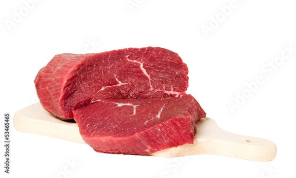 Fototapeta Raw sliced meat on cutting board