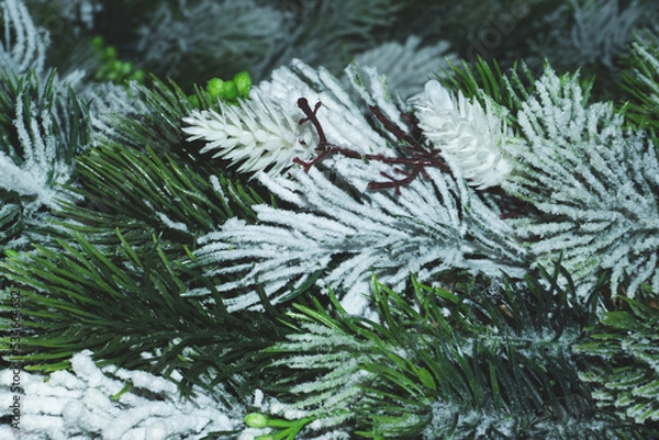 Fototapeta Artificial fir tree branches with needles close up. Christmas decoration
