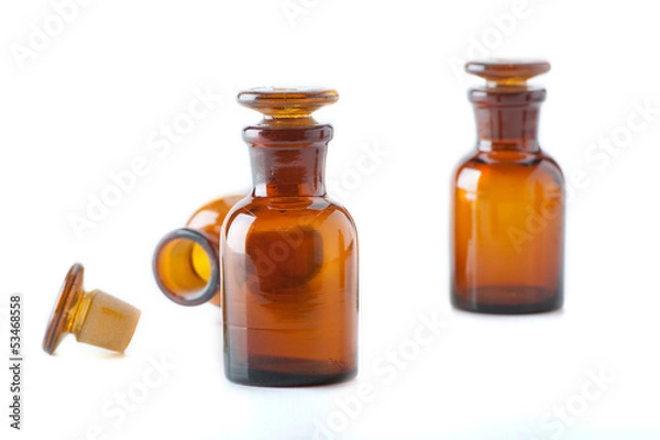 Fototapeta Small chemical glass bottles on white background