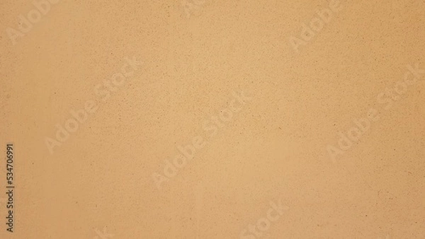 Fototapeta Orange painted plaster wall.