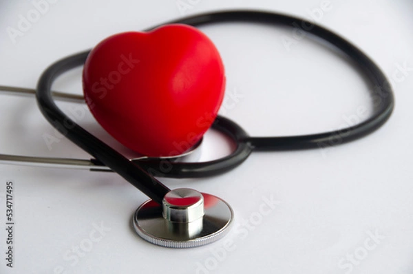 Fototapeta Stethoscope with heart shape on white background. Copy space and health concept