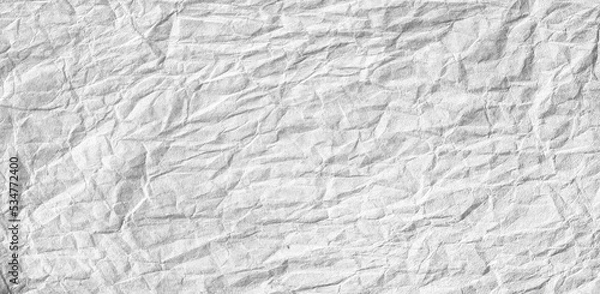 Fototapeta White crumpled paper background or texture