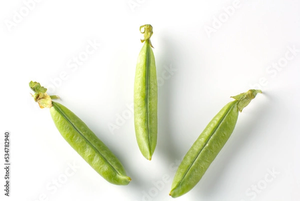 Fototapeta Pea pods on a white background, green peas in a pod