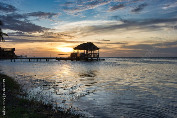 Obraz sunset in the caribbean with over water bungalow