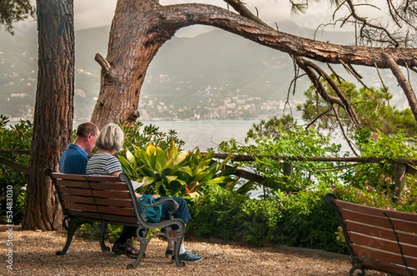Obraz stara para siedzi w parku