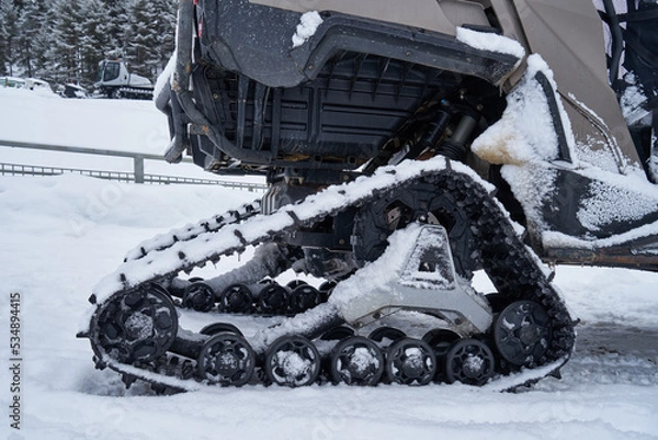 Fototapeta ATV with a tracked system.