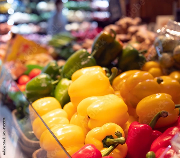 Fototapeta Bell pepper on supermarket shelf with blur background