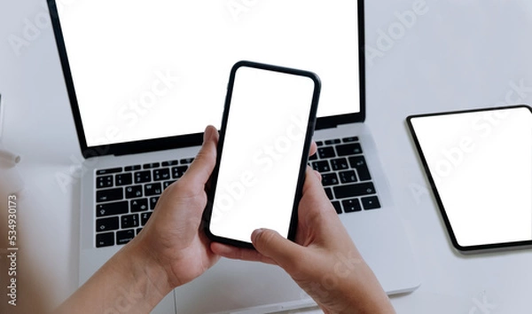 Fototapeta hand holding smartphone with computer on empty background PNG