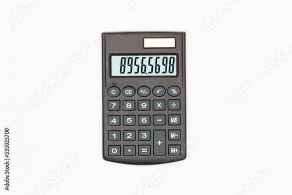 Fototapeta Calculator with big buttons with numbers on the digital screen on a white background. Isolated. Solar powered financial calculator. Electronic machine for math. Business office supplies. Close-Up