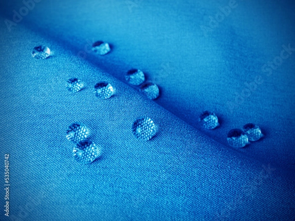 Fototapeta Technological blue waterproof and breathable fabric with drops