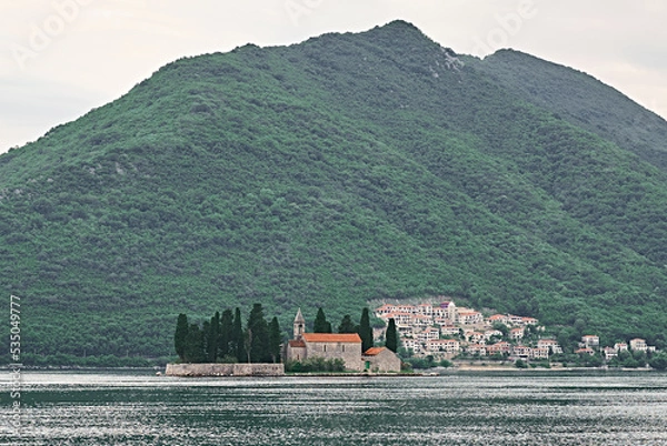 Obraz church on small island in the middle of a lake in europe