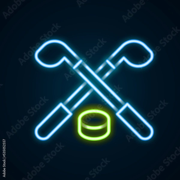 Fototapeta Glowing neon line Ice hockey sticks and puck icon isolated on black background. Game start. Colorful outline concept. Vector