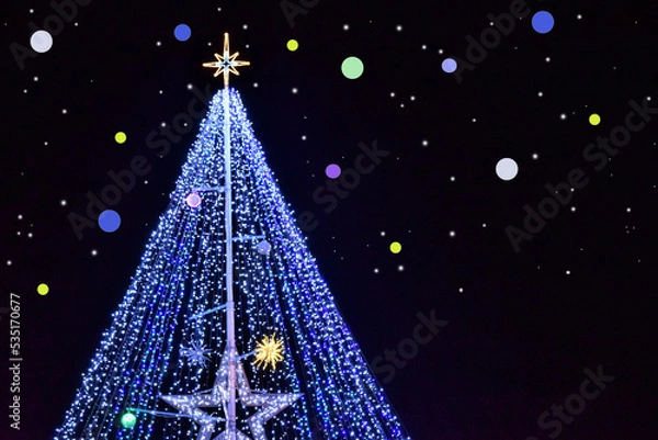 Obraz 夜空に輝くクリスマスツリーと星とイルミネーション