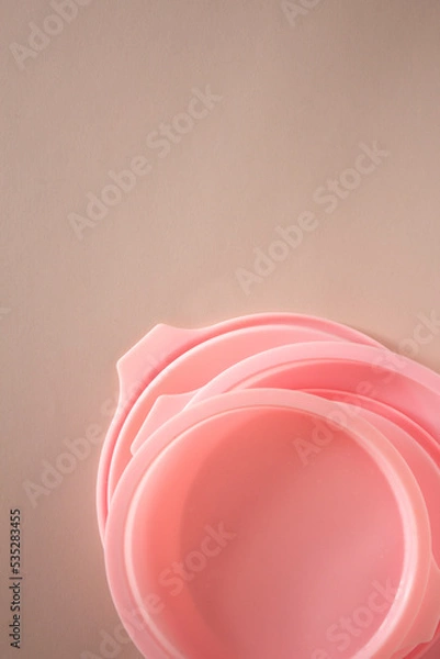 Fototapeta different pink silicone molds for baking on a pink background
