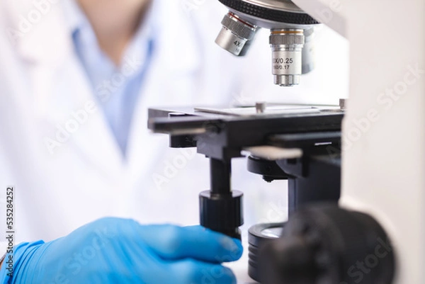 Fototapeta scientific microscope for using in science laboratory, biology research scientist in medicine technology term using equipment for experiment education of chemistry or microbiology and medical