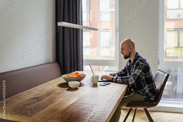 Obraz Stay home young man works from home. peoples were advised not to go to the office and work from home