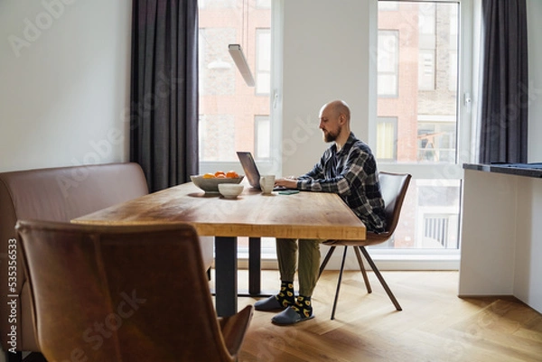Obraz Stay home young man works from home. peoples were advised not to go to the office and work from home