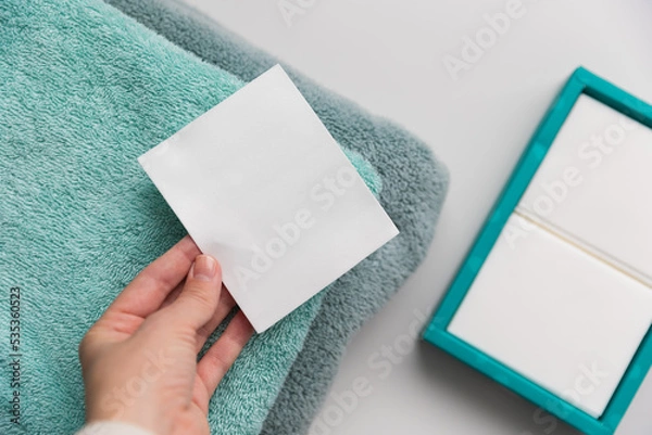 Obraz Woman holding a laudry sheet