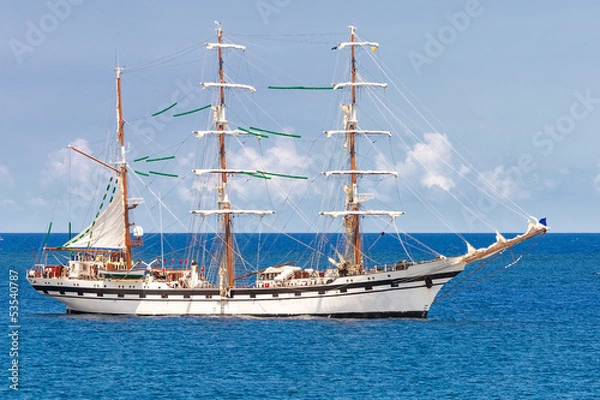 Fototapeta Sailing ship on a calm blue sea