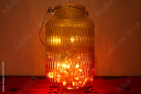 Obraz glass bottle lit with warm colors