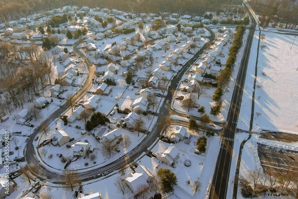Fototapeta An American town in New Jersey was hit by severe snowstorm that covered roofs of residential housing complexes in area